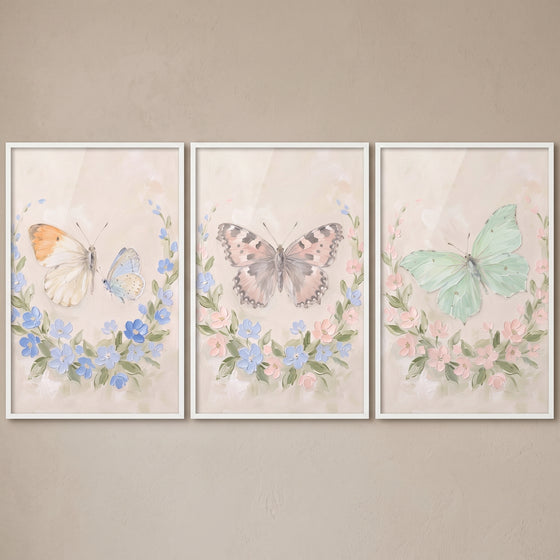 Rustic country floral butterfly wall art set of 3 featuring soft watercolor butterflies and delicate flower wreaths.