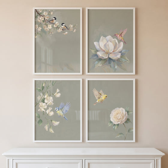 Serene botanical garden bird wall art set of 4 features birds and white flowers on soft green backgrounds in white frames.