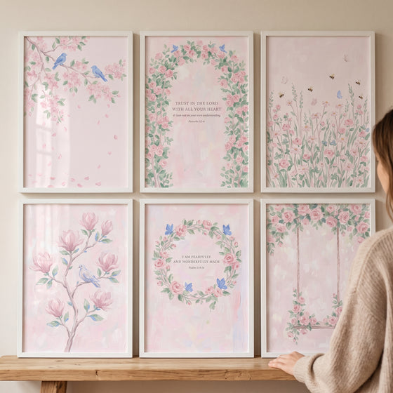 Soft blush blossom garden wall art set of 6 featuring floral designs and birds in white frames on a wall above a shelf.