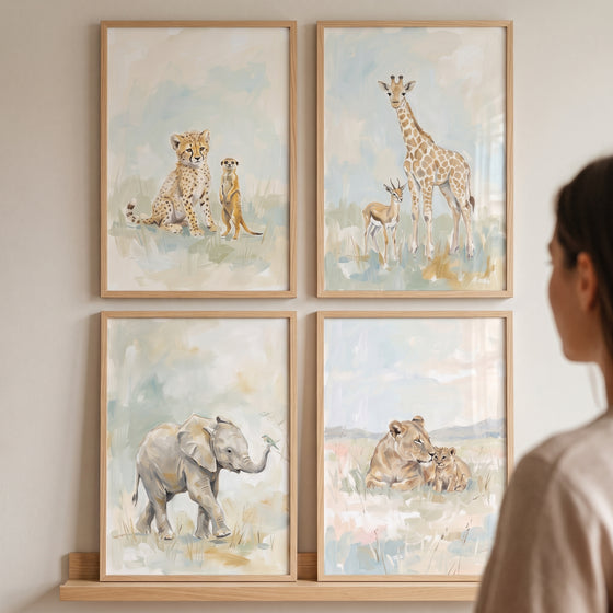 Framed soft watercolor safari animal wall art set of 4 with a cheetah, giraffe, elephant, and lioness with cub.