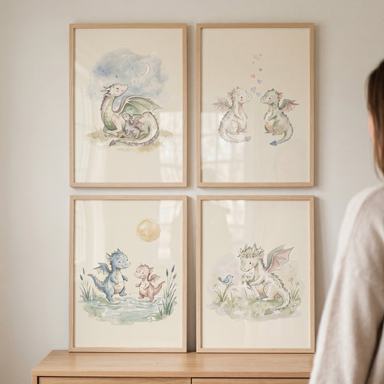 Sophisticated pastel baby dragon wall art set of 4 in light wood frames hangs on a wall above a wooden dresser.