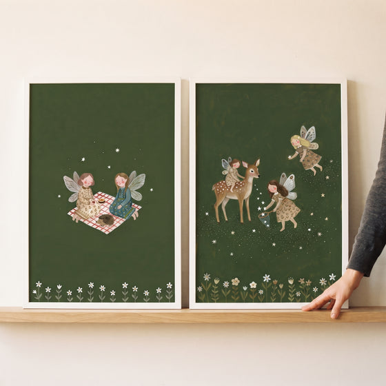 Starry floral folk fairies wall art set of 2 featuring whimsical woodland scenes with a deer and a picnic on dark green.
