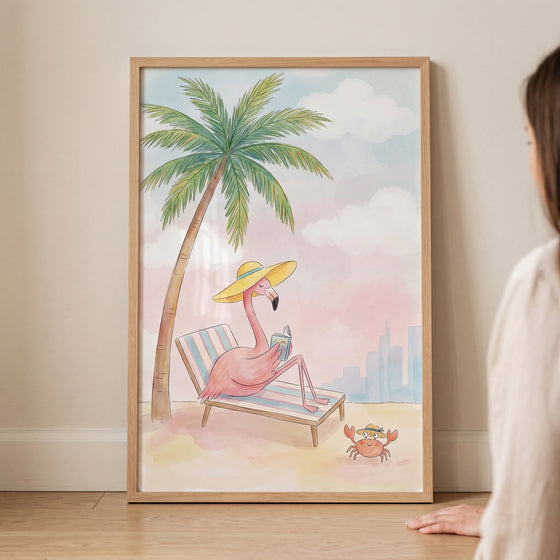 Framed sun hat reading flamingo wall art shows a flamingo on a beach chair next to a palm tree and a small crab.