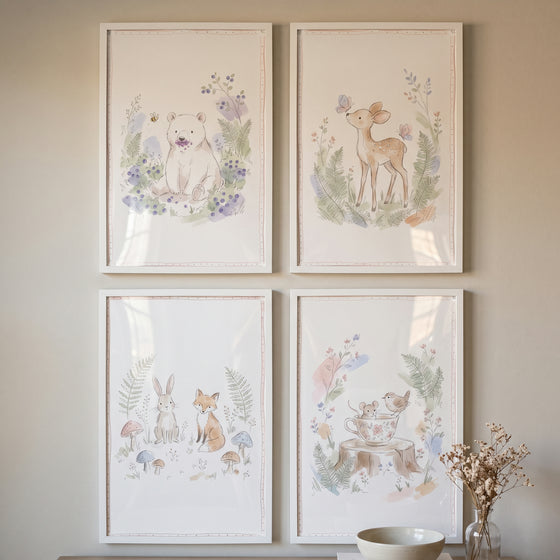 Tender watercolor woodland animal wall art set of 4 featuring a bear, deer, fox, rabbit, and mouse in white frames.