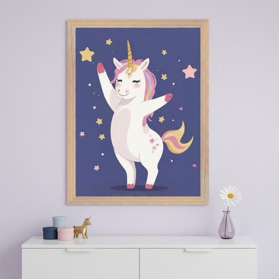 Modern kid's room with a white dresser. A light wood framed print of a dancing cartoon unicorn with a pink mane and golden horn on a starry dark blue background hangs centered above the dresser.