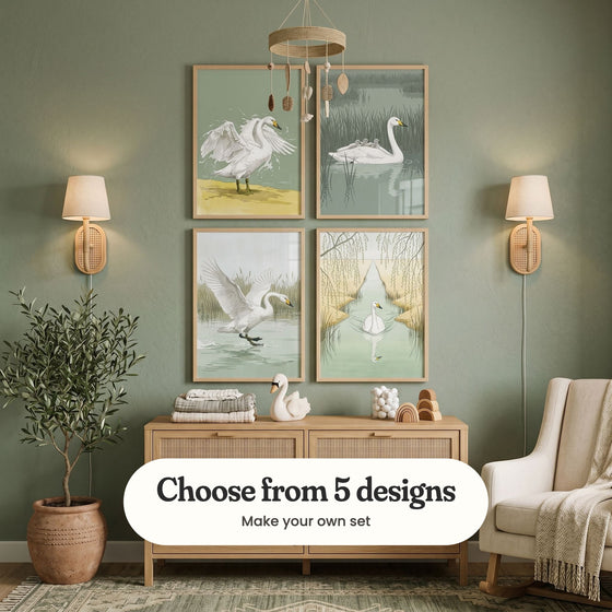 Sage green nursery with four swan prints in light wood frames in two rows between two rattan wall lights, above a rattan dresser with a swan toy and folded blankets, under a hanging mobile, beside an olive tree and a rocking chair: Majestic Swan Splash, Swan Family Voyage, Graceful Water Landing and Serene Swan Reflection, with a label reading Choose from 5 designs, Make your own set