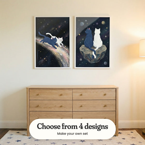 Warm cream room with two space cat prints in white frames above a light wood dresser on a star patterned rug, beside a floor lamp: Cosmic Stardust Cats and Celestial Tail Tangle, with a label reading Choose from 4 designs, Make your own set