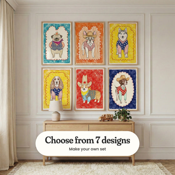 Cream panelled kids' room with six dog prints in light wood frames in two rows above a light wood sideboard with a lamp, a wooden toy truck and a potted plant, beside linen curtains: Cowboy Dreamer, Blushing Bandit, Star-Spangled Husky, Patriotic Pup Pal, Little Sheriff Pup and Polka Dot Pal, with a label reading Choose from 7 designs, Make your own set