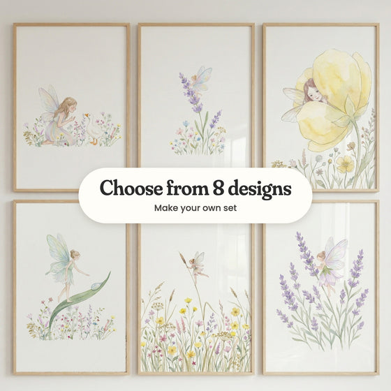 Six fairy prints in light wood frames in two rows on a pale wall: a fairy greeting a white duck, a fairy with rainbow wings on a lavender stem, a fairy peeking out of a yellow flower, a fairy walking up a long leaf, a tiny fairy holding a cattail above buttercups and a fairy in a lavender petal dress, with a label reading Choose from 8 designs, Make your own set
