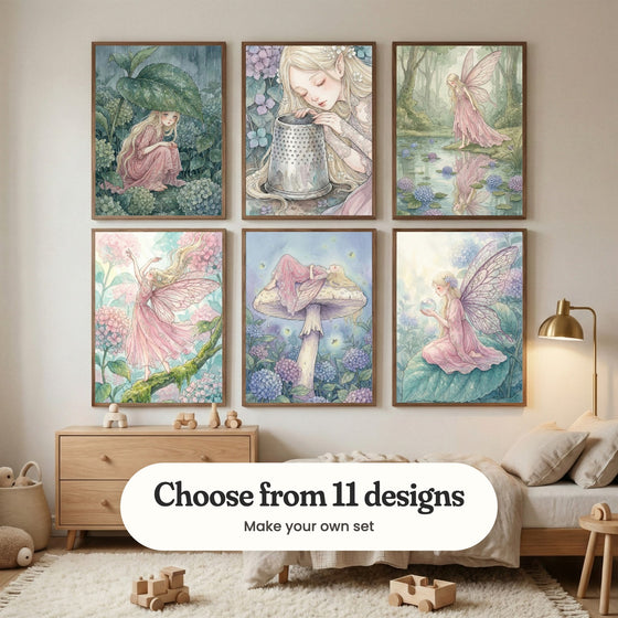 Cream kids' room with six fairy prints in dark wood frames in two rows above a light wood dresser with wooden toys and a low bed with soft pillows, beside a brass floor lamp: Rainy Leaf Shelter, Enchanted Thimble Rest, Winged Forest Serenity, Floral Winged Sprite, Whimsical Forest Slumber and Mystic Garden Fairy, with a label reading Choose from 11 designs, Make your own set