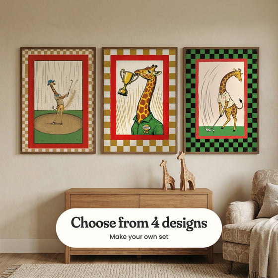 Cream kids' room with three giraffe prints in dark wood frames above a light wood dresser with two wooden giraffe figures, beside a patterned armchair with a throw: Towering Tee Time, The Tallest Victor and Spotted Swing, with a label reading Choose from 4 designs, Make your own set
