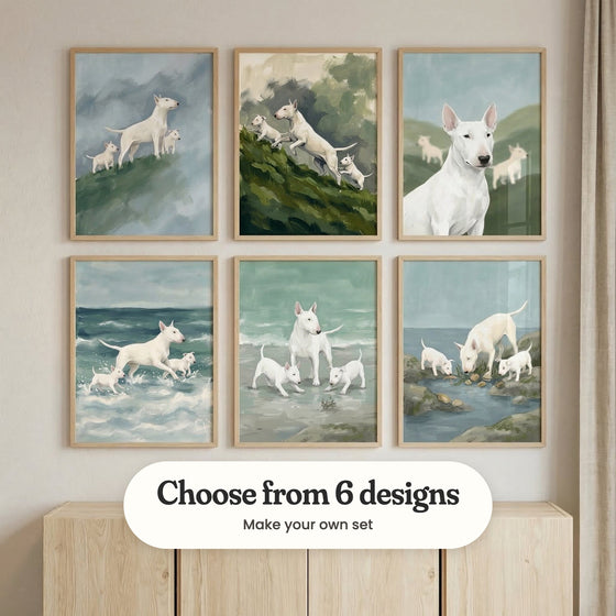 Cream wall with six bull terrier prints in light wood frames in two rows above a pale wood cabinet: Misty Hill Pack, Mossy Slope Scramble, Rolling Hill Hounds, Surf And Paws, Seaside Canine Family and Tide Pool Discovery, with a label reading Choose from 6 designs, Make your own set