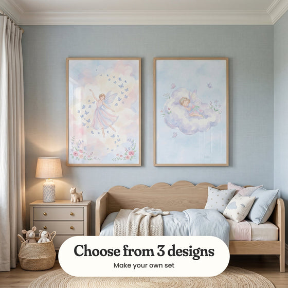 Pale blue nursery with two fairy prints in light wood frames above a light wood daybed with a scalloped headboard, cushions and a knit throw, beside a nightstand with a table lamp and a small toy animal, a basket with a floppy eared plush bunny and a round eared plush toy, linen curtains and a round jute rug: Celestial Fairy Waltz and Dreamy Fairy Slumber, with a label reading Choose from 3 designs, Make your own set
