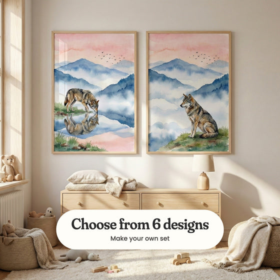 Sunny cream nursery with two wolf prints in light wood frames above a light wood dresser with a lamp, a folded pillow and a throw, beside a basket of teddy bears, a pouf and a shaggy rug with wooden toys: Silent Wolf Reflection and Misty Peak Watcher, with a label reading Choose from 6 designs, Make your own set