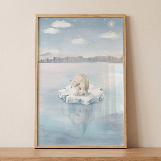 Water reflection polar bear wall art depicts a bear on an ice floe under a starry sky and mountains in a wood frame.