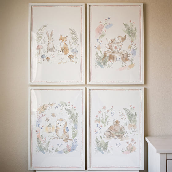Watercolor forest animal set wall art set of 4 featuring a rabbit, fox, owl, turtle, and mouse in white frames.