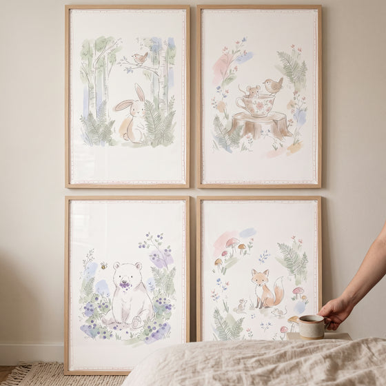 Watercolor pencil woodland animal wall art set of 4 featuring a rabbit, bear, fox, and birds in soft pastel tones.