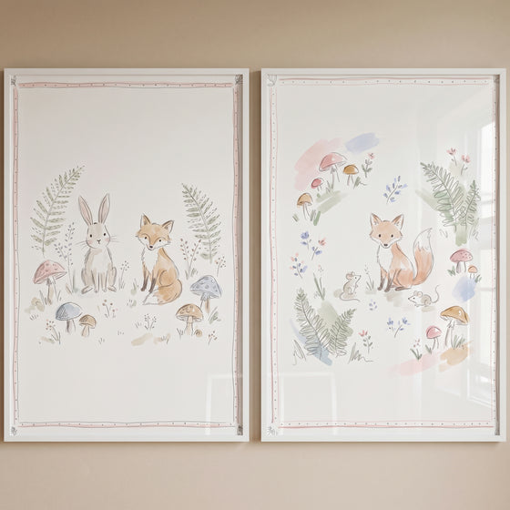 Whimsical mushroom forest animal wall art set of 2 watercolor prints featuring a rabbit, foxes, and mice in white frames.