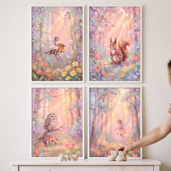 Whimsical sunlit woodland wall art set of 4 with fairies, a squirrel, a bird, and an owl in soft pastel colors.