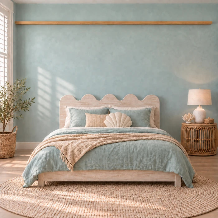Kids' room with three mermaid prints above the bed