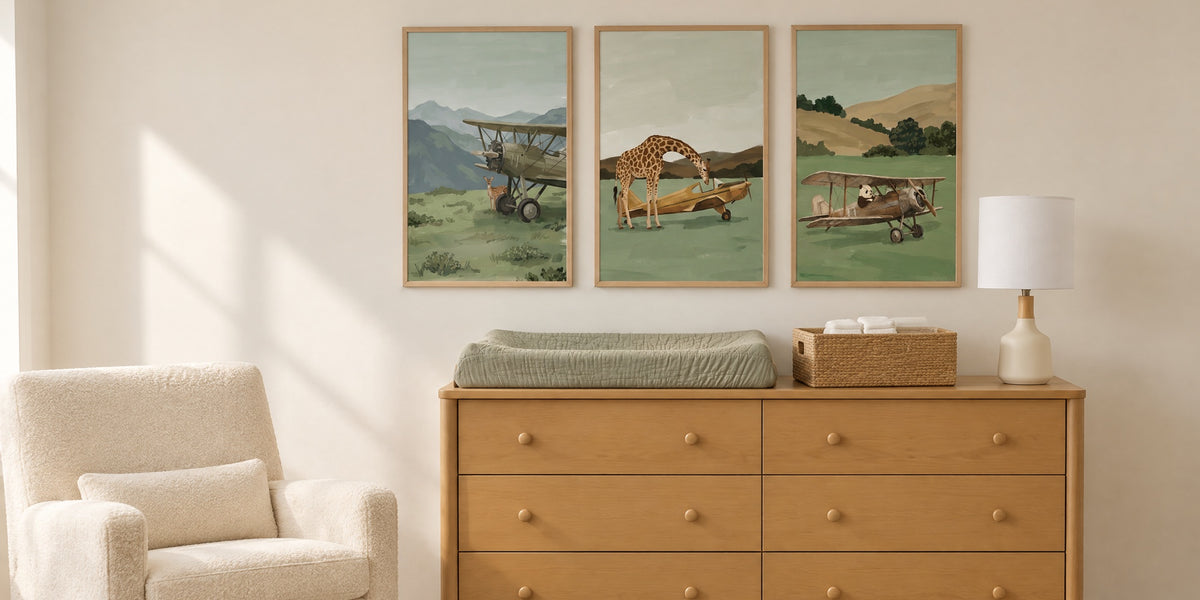 Vintage airplane nursery: changing table with three sage airplane prints above it
