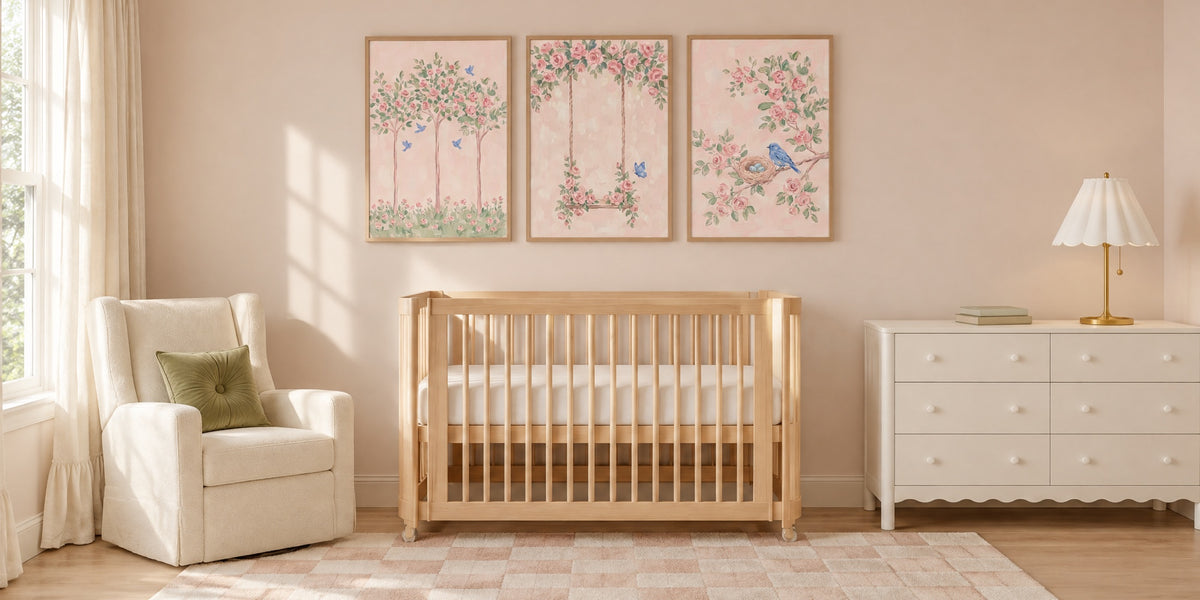 Rose nursery: three framed pink rose prints above a light wood crib, with an ivory glider and a white dresser