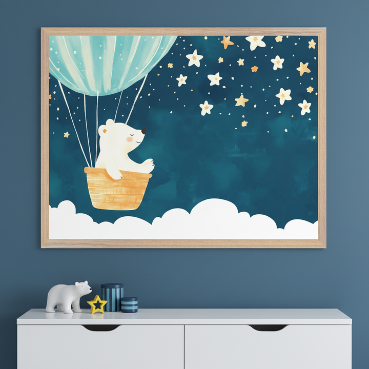 Modern kid's room with a deep blue wall and a white dresser. A large framed print of a watercolor polar bear in a light blue hot air balloon, flying above clouds under a starry dark blue sky, hangs above the dresser. A white bear figurine and blue containers are on the dresser.