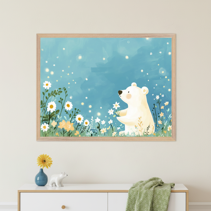 Modern room with a white dresser. A large light wood framed watercolor-style print hangs above the dresser, depicting a white polar bear holding white flowers in a field of daisies under a sparkling blue sky. A blue vase with a yellow flower and a white polar bear figurine are on the dresser.