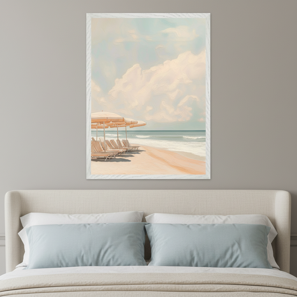 Modern bedroom with a light beige upholstered bed and light blue pillows. A framed painting of a calm beach scene with striped umbrellas, lounge chairs, and soft pastel clouds hangs centered above the bed.