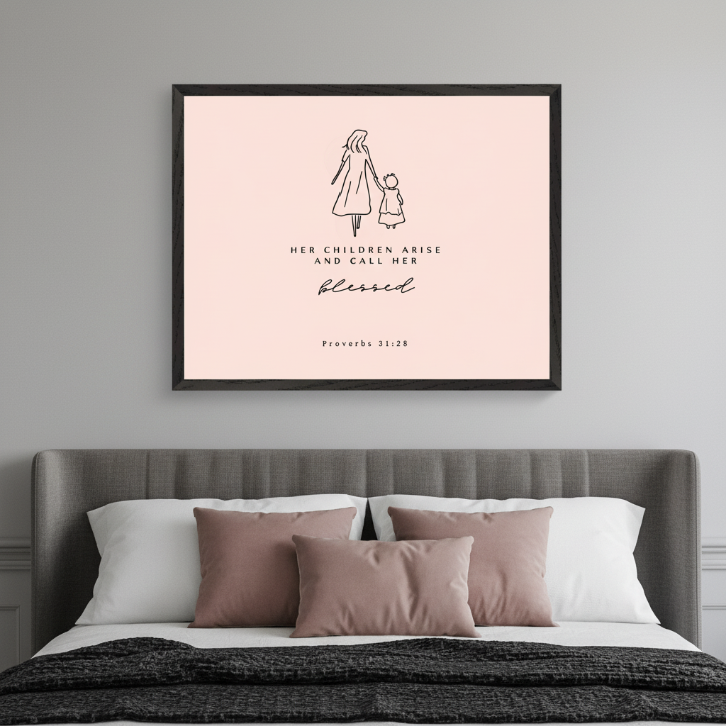 Modern bedroom with a gray upholstered bed. A large framed light pink print featuring a minimalist line drawing of a mother and child, and the text "HER CHILDREN ARISE AND CALL HER BLESSED. Proverbs 31:28", hangs centered above the bed.