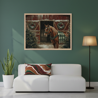 Modern living room with a white sofa. A large framed painting of a brown horse in a green plaid blanket, standing by a red barn with wreaths, Christmas trees, and snow, hangs centered above the sofa. A floor lamp is right, and a potted plant is left.