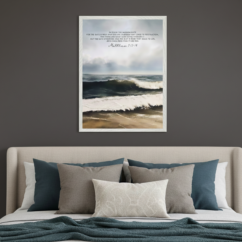 Modern bedroom with a bed and upholstered headboard. A framed print of ocean waves on a beach with text from Matthew 7:13-14 hangs centered above the bed.