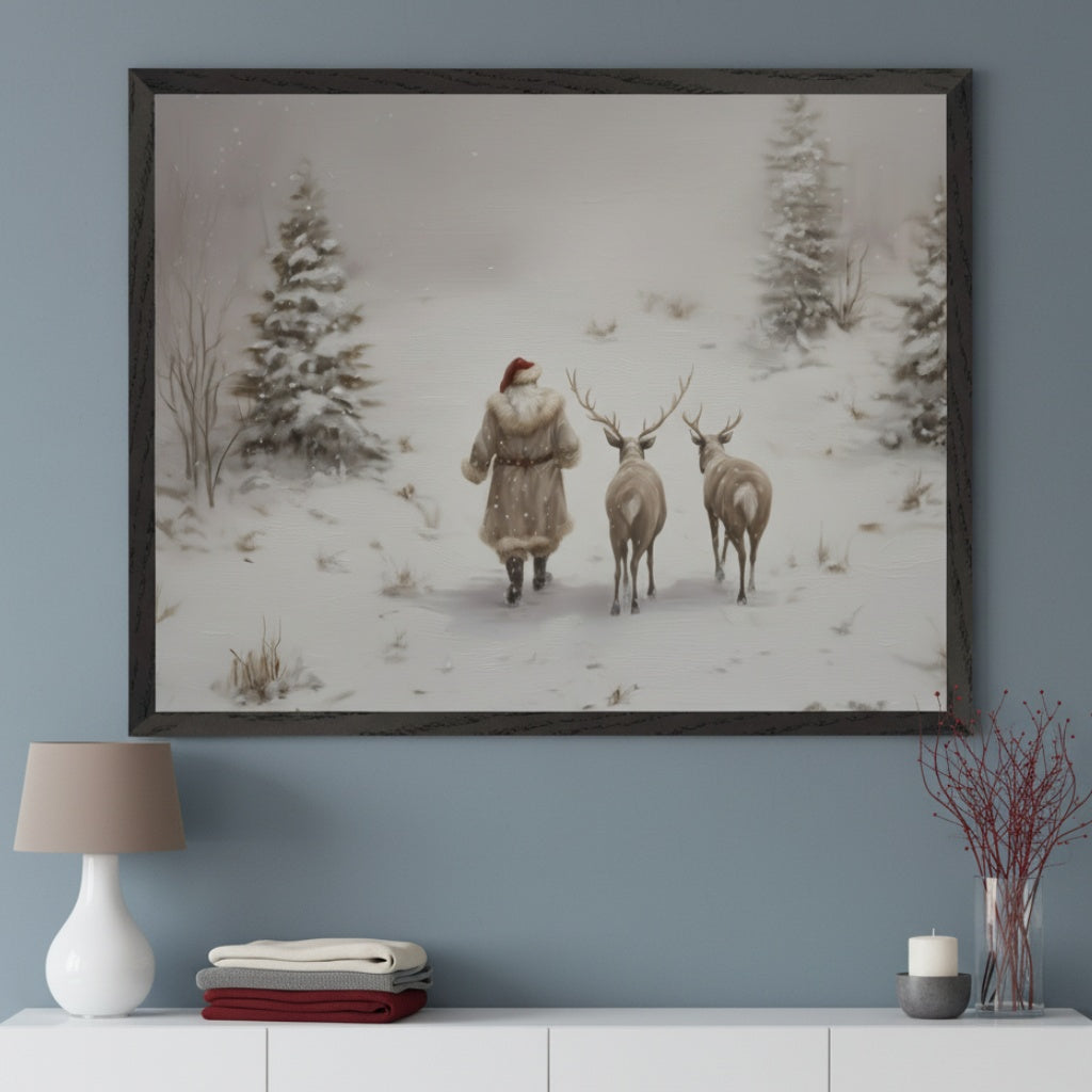 Modern room with a blue-gray wall and white console table. A large framed painting of Santa Claus in a fur coat walking in a snowy forest with two deer behind him, centered above the table.