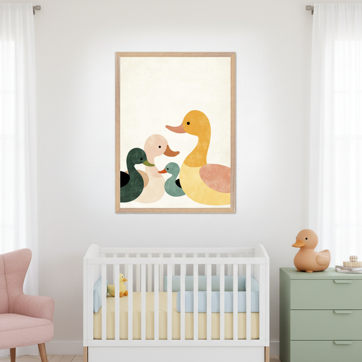 Modern nursery with a white crib, pink armchair, and green dresser. A large framed print of a family of five minimalist, colorful ducks hangs centered above the crib.