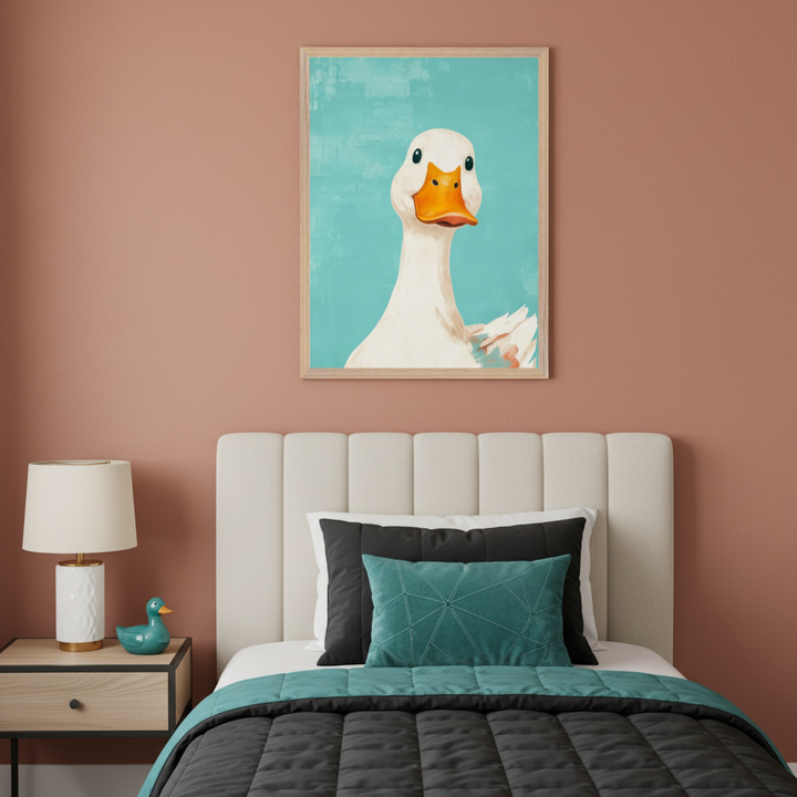 Modern bedroom with an upholstered bed and nightstand. A framed painting of a white duck with an orange beak against a teal background hangs above the bed, slightly right of center.