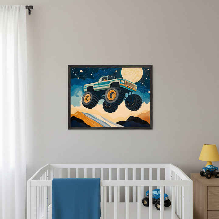 Modern nursery with a white crib and blue blanket, and a wooden nightstand. A framed print of a light blue monster truck jumping over hills under a full moon and starry sky, in a cartoon style, hangs centered above the crib.
