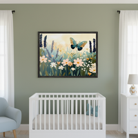 Modern nursery with sage green walls. A large framed illustration of a blue-green butterfly over a field of flowers hangs centered above a white crib. A light blue armchair is on the left, and a white dresser with a butterfly lamp is on the right.