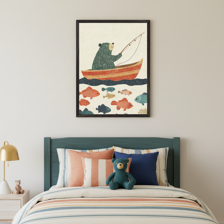 Kid's bedroom with a teal bed and striped bedding. A gold lamp sits on a nightstand to the left. Above the bed hangs a framed illustration of a green bear in a red boat fishing. Below the boat, many colorful fish swim in the water.