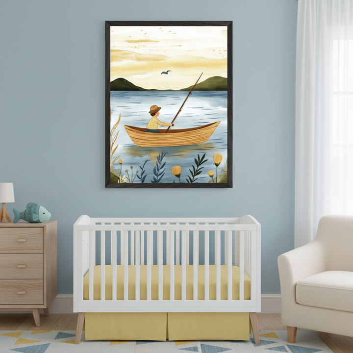 Modern nursery with a white crib, light wood dresser, and cream armchair. A large framed watercolor art print hangs above the crib, depicting a person in a boat fishing on a lake at sunset, surrounded by mountains and flowers.