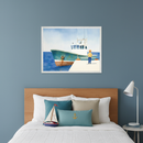 Nautical-themed kid's bedroom with a wooden headboard bed. A large framed watercolor painting of a green fishing boat docked at a pier with a person looking at it hangs centered above the bed. A model sailboat and anchor pillow are on the bed.