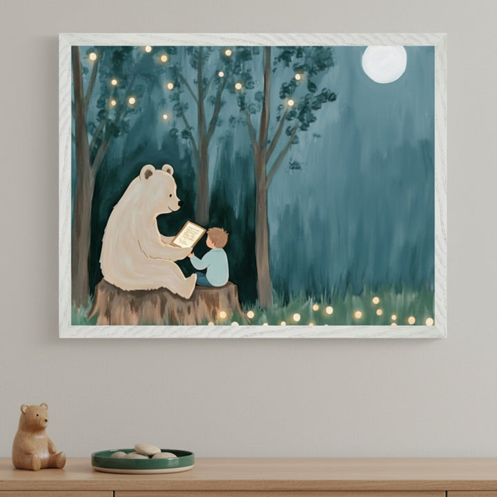 Modern child's room with a light wood table. A framed painting above shows a large white bear reading a glowing book to a small child on a tree stump in a dark forest with hanging lights and a full moon, in a whimsical style.