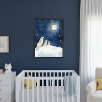 Modern nursery with a white crib and partially visible white dresser against a dark blue wall. A framed watercolor print of a wolf family howling at the moon and stars hangs above the crib.