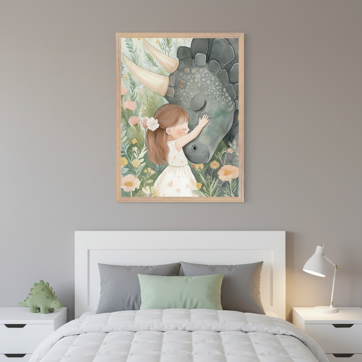 Kid's bedroom with a white bed and two nightstands. Centered above the bed is a framed print depicting a little girl hugging a gray, triceratops-like dinosaur amidst pastel flowers, in a soft illustration style.