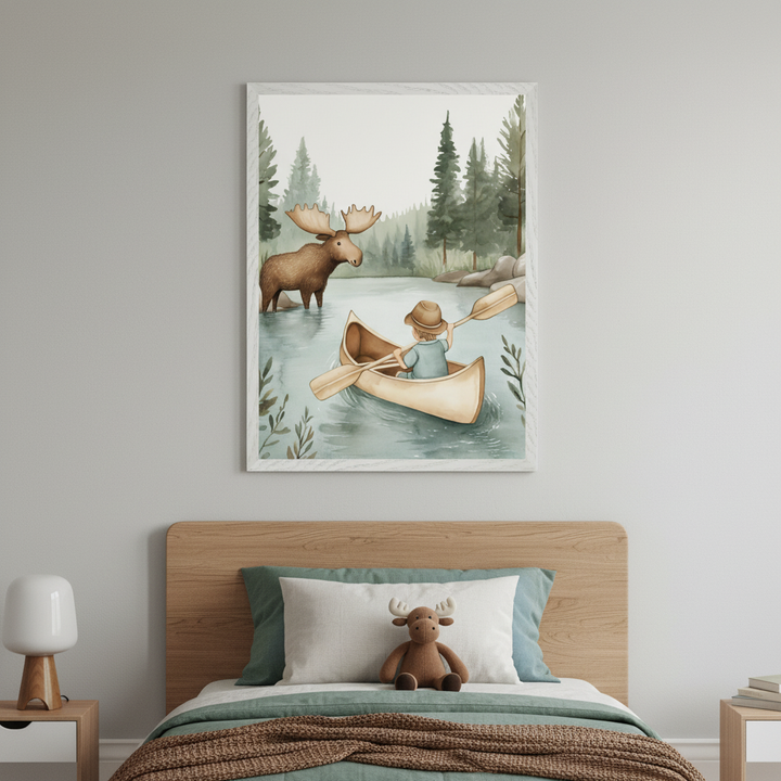 Modern kid's bedroom with a wooden bed. A large framed watercolor painting of a boy in a canoe with a moose in a lake and pine trees hangs above the bed. A moose stuffed animal rests on the bed, and a lamp sits on a nightstand.