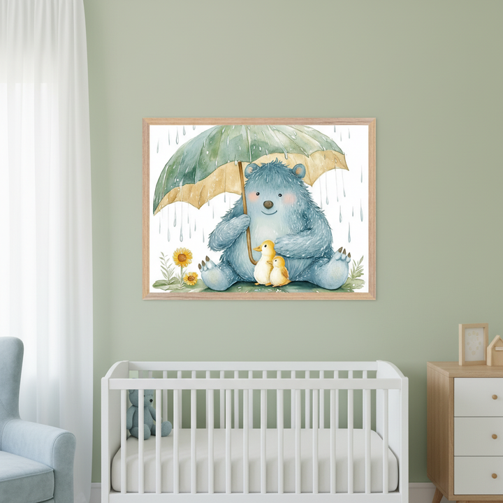 Nursery with sage green walls. A large wooden-framed watercolor print of a blue bear holding a green umbrella over two yellow ducklings, with sunflowers and raindrops, hangs centered above a white crib. A light blue armchair is left, and a wooden dresser is right.