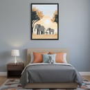 Kid's bedroom with a beige upholstered bed, gray duvet, coral and blue pillows. A dark brown nightstand on the left holds a white lamp. Above the bed, a large framed print shows three gray elephants walking right in a savanna at sunset with trees, in an illustrative style.