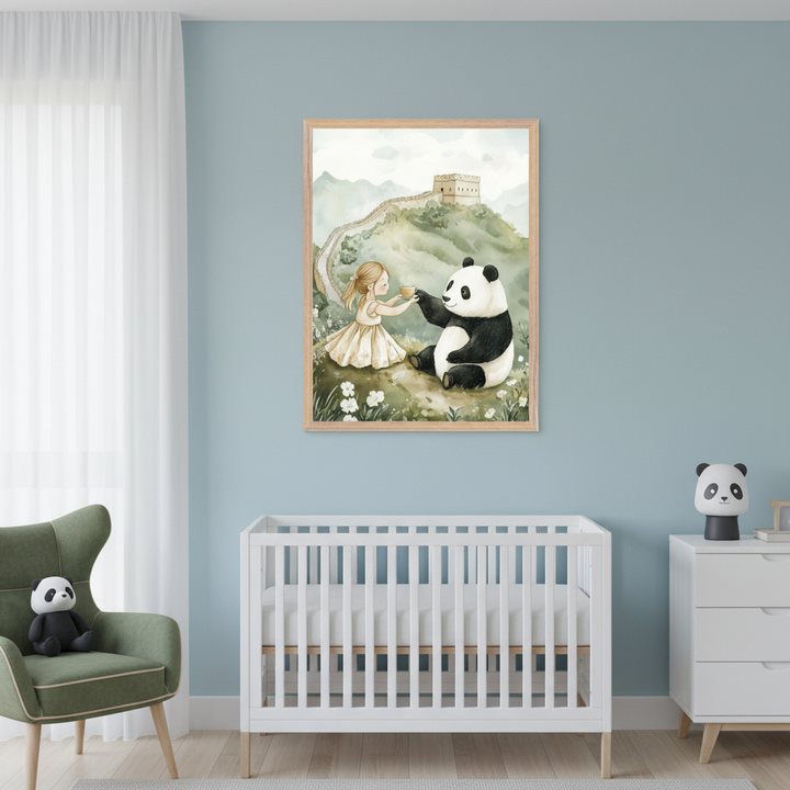 Modern nursery featuring a white crib and dresser, plus a green armchair. A framed watercolor painting showing a girl giving a cup to a panda, with the Great Wall in the background, hangs on the blue wall above the crib.