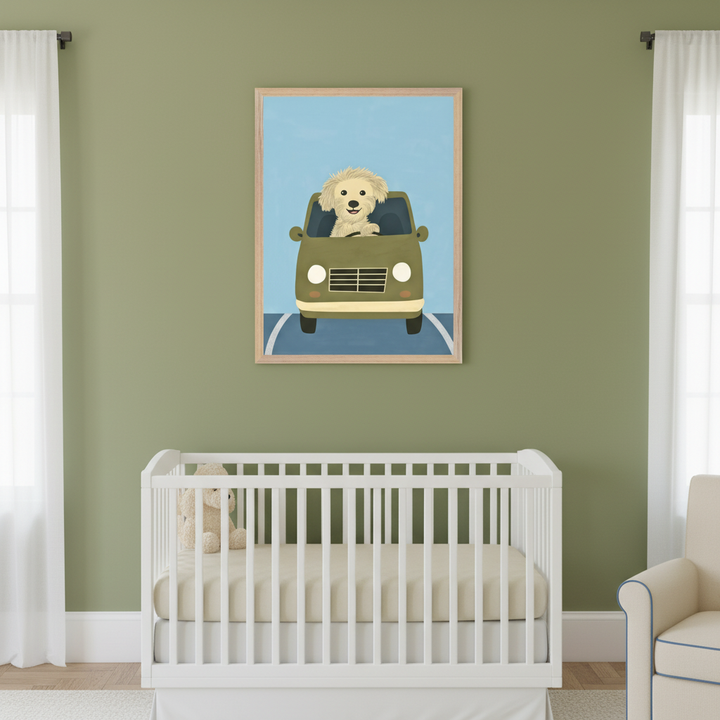 Nursery with sage green walls, white crib, and white curtains. A framed print of a fluffy yellow dog driving a green car on a blue road hangs above the crib. A light beige armchair is to the right.