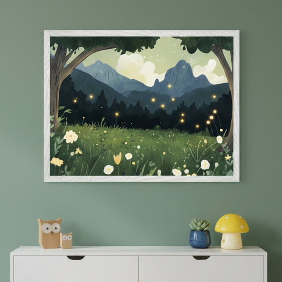 Modern kid's room with a white dresser. A framed whimsical illustration of a dark forest landscape with glowing fireflies, mountains, and a field of white and yellow flowers hangs centered above the dresser. Wooden owls, a succulent, and a mushroom lamp decorate the dresser.