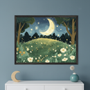 Modern room with a white dresser below a large framed whimsical illustration. The artwork depicts a night landscape with a crescent moon, stars, trees, and a field of glowing flowers on a hill. A wooden moon and a small vase with a dried flower sit on the dresser.
